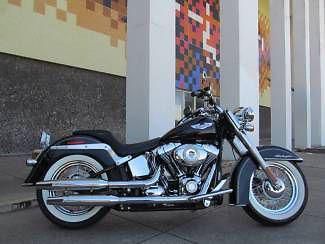 2010 black harley flstn softail deluxe. chrome and clean. what a combo !