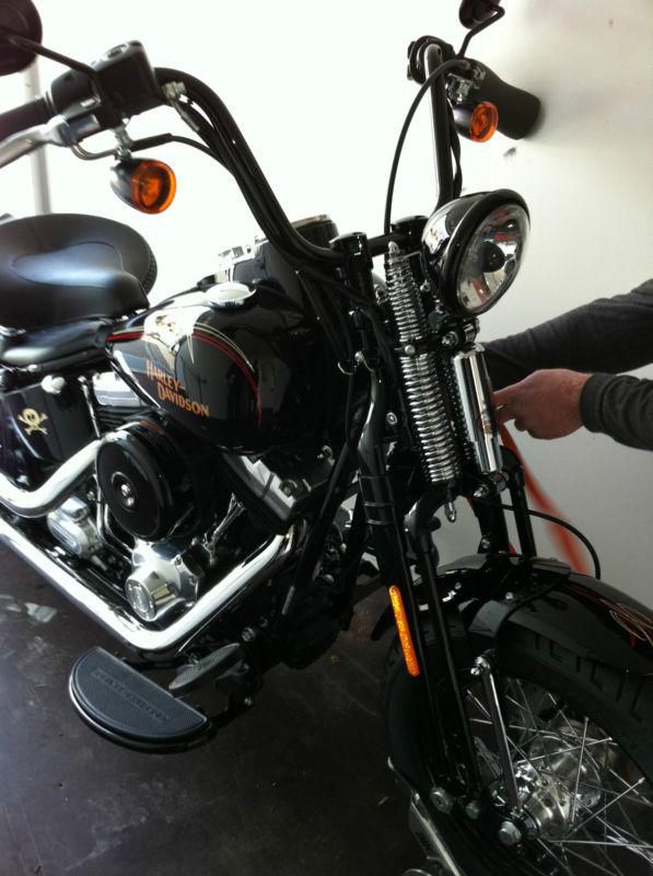 H-D Crossbones collector's item, factory black gloss paint, under 4k miles.